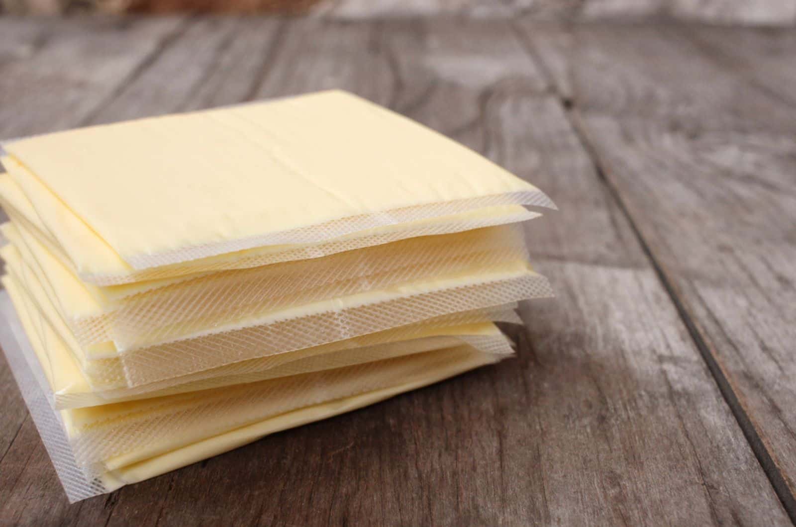 Slices of american cheese on the table