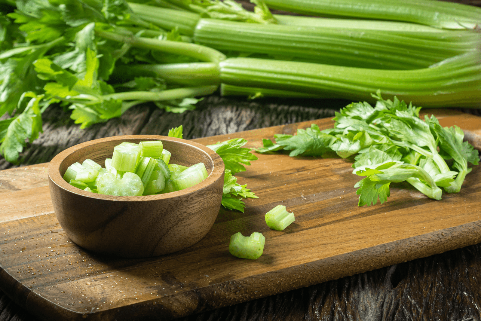 fresh celery in a wooden bowl