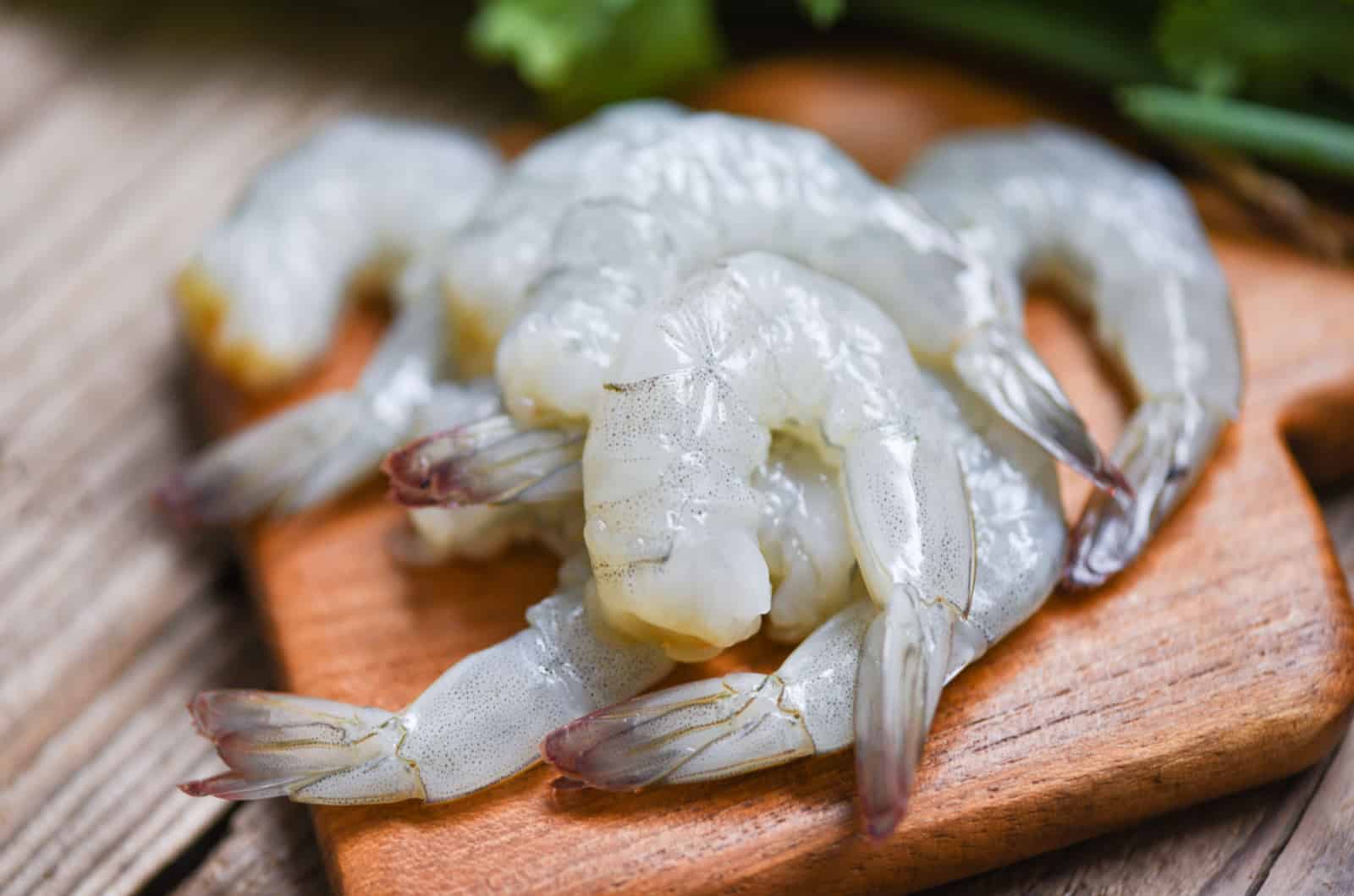 raw shrimp on a cutting board
