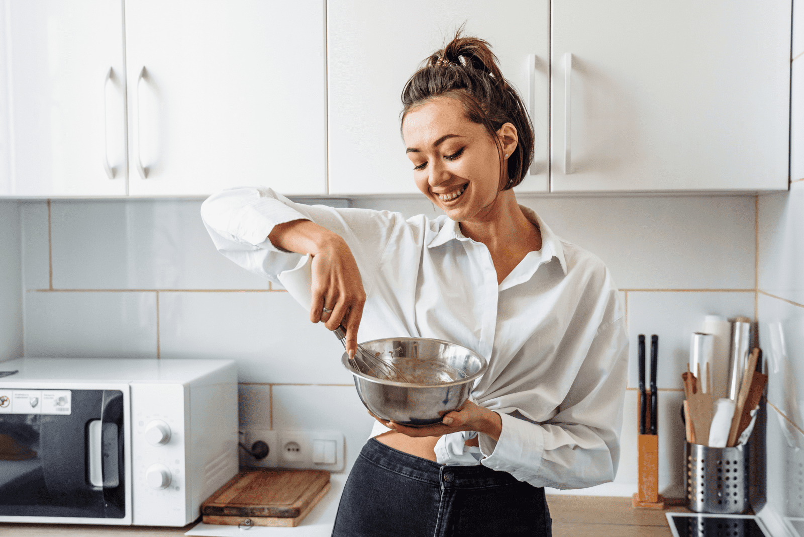 smiling woman mixing in a bowl