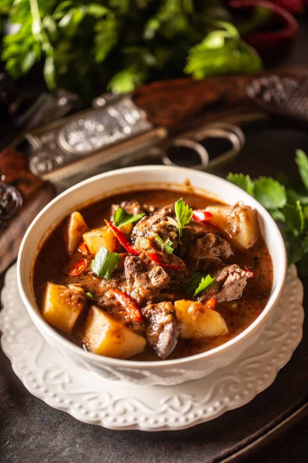 Deer stew in a bowl hunting weapon as a decoration.