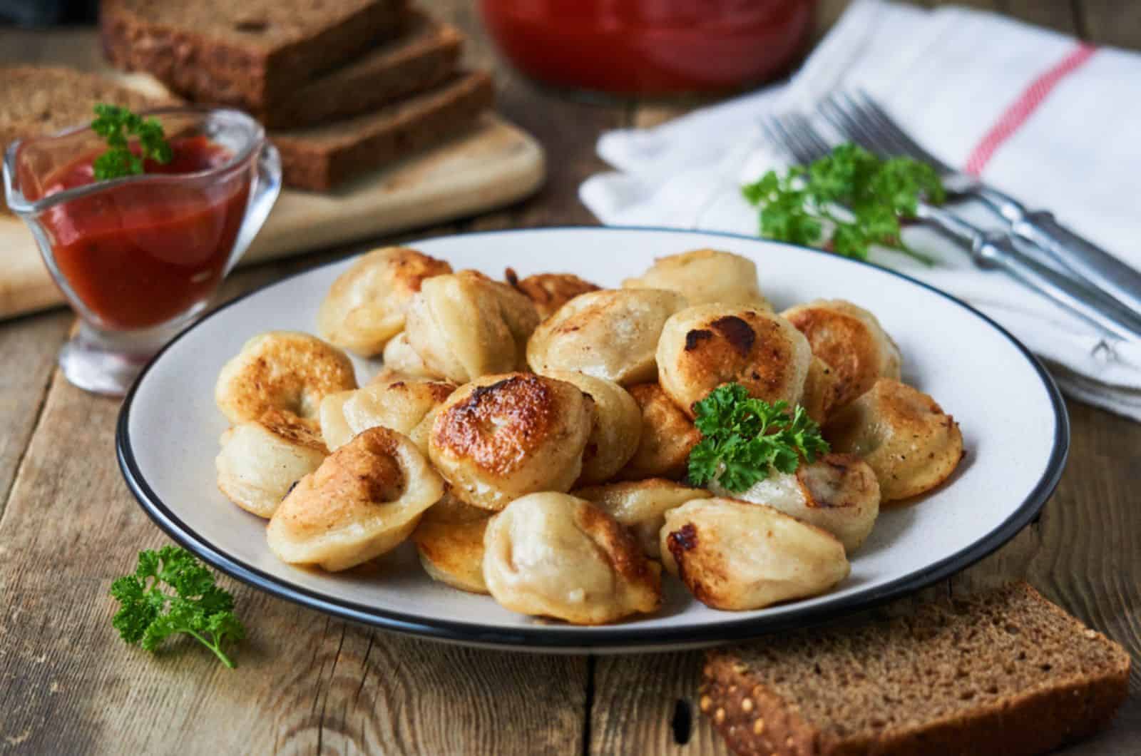 Fried dumplings stuffed with minced meat on a plate