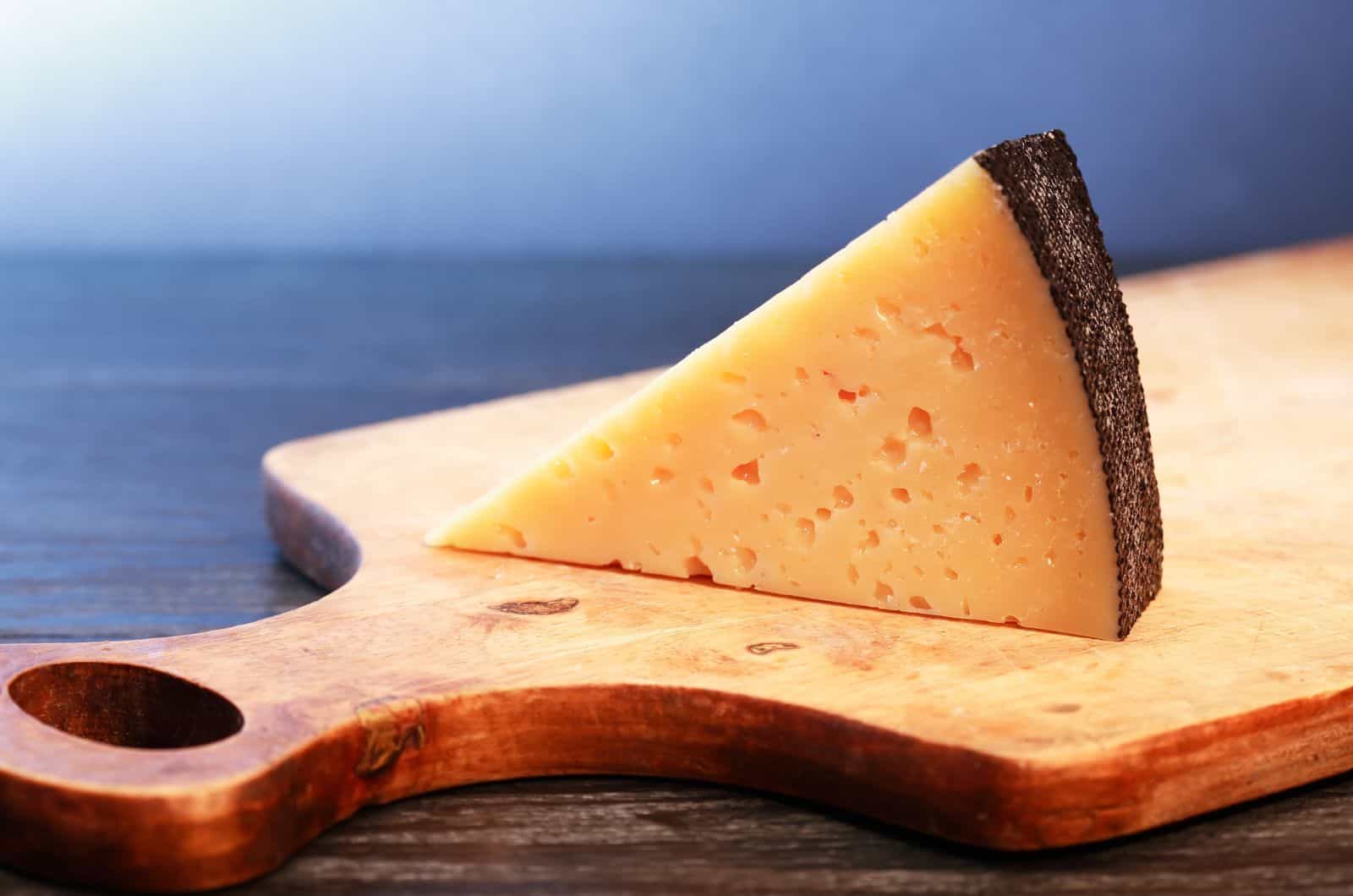 Gruyere cheese on cutting board