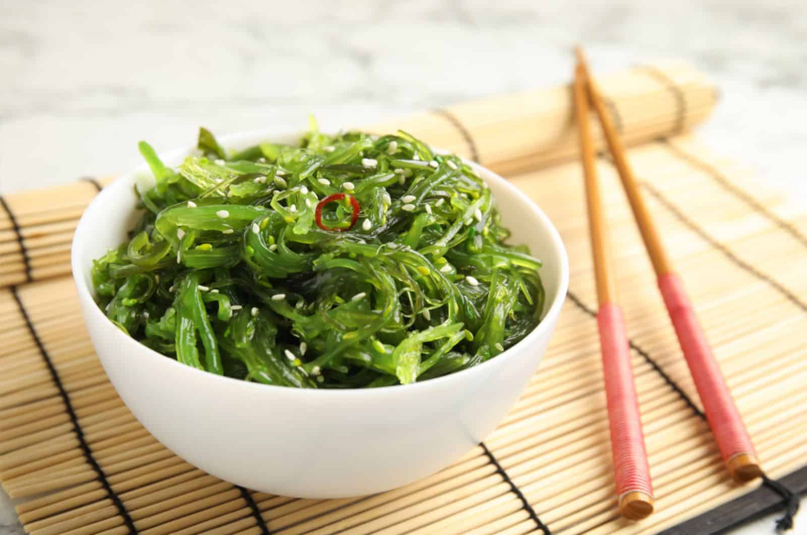 Japanese seaweed salad served on table