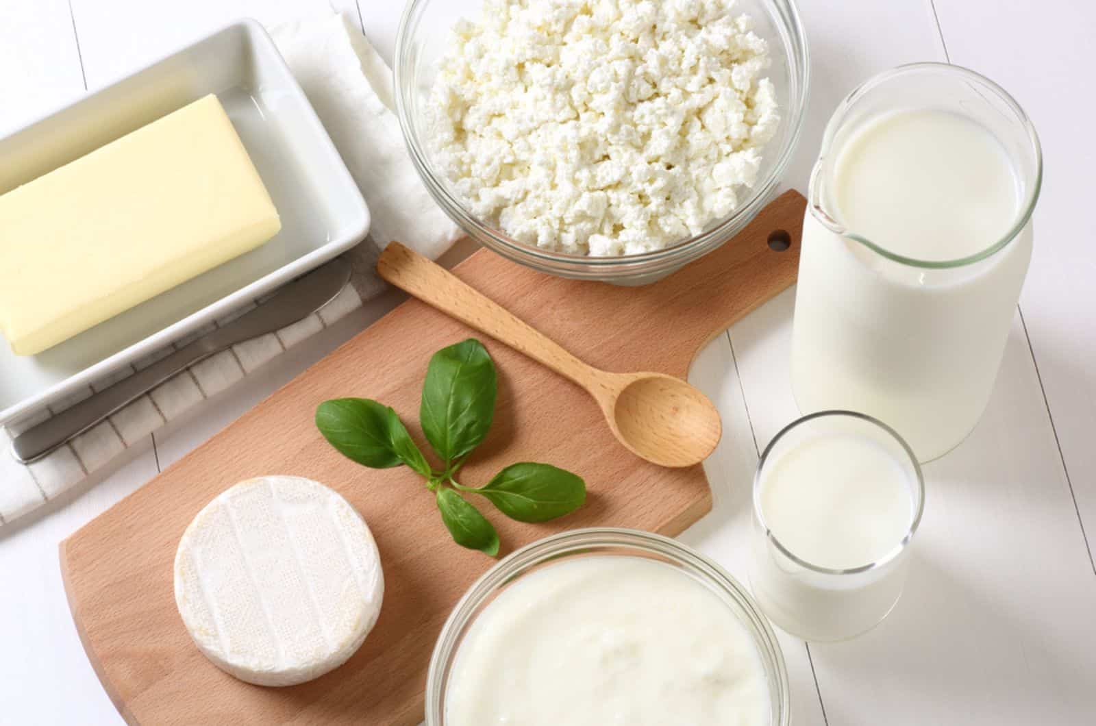 Many dairy products on a white table