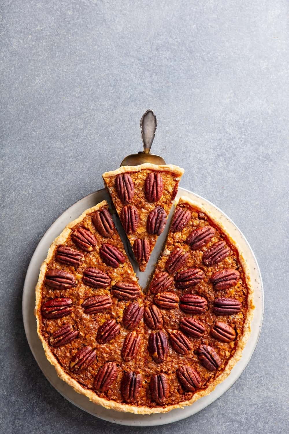 Pecan nut pie, on a plate.
