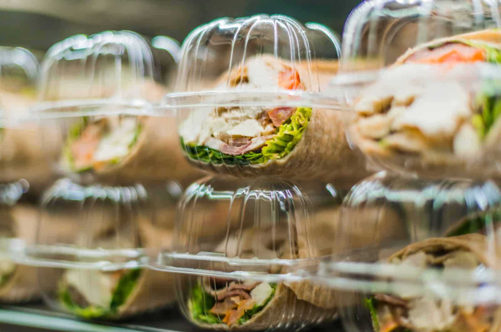 Pre-packaged sandwiches put up for sale in a commercial refrigerator