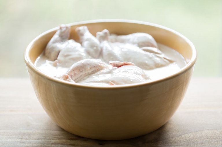 Cornish hens soaking in a buttermilk brine