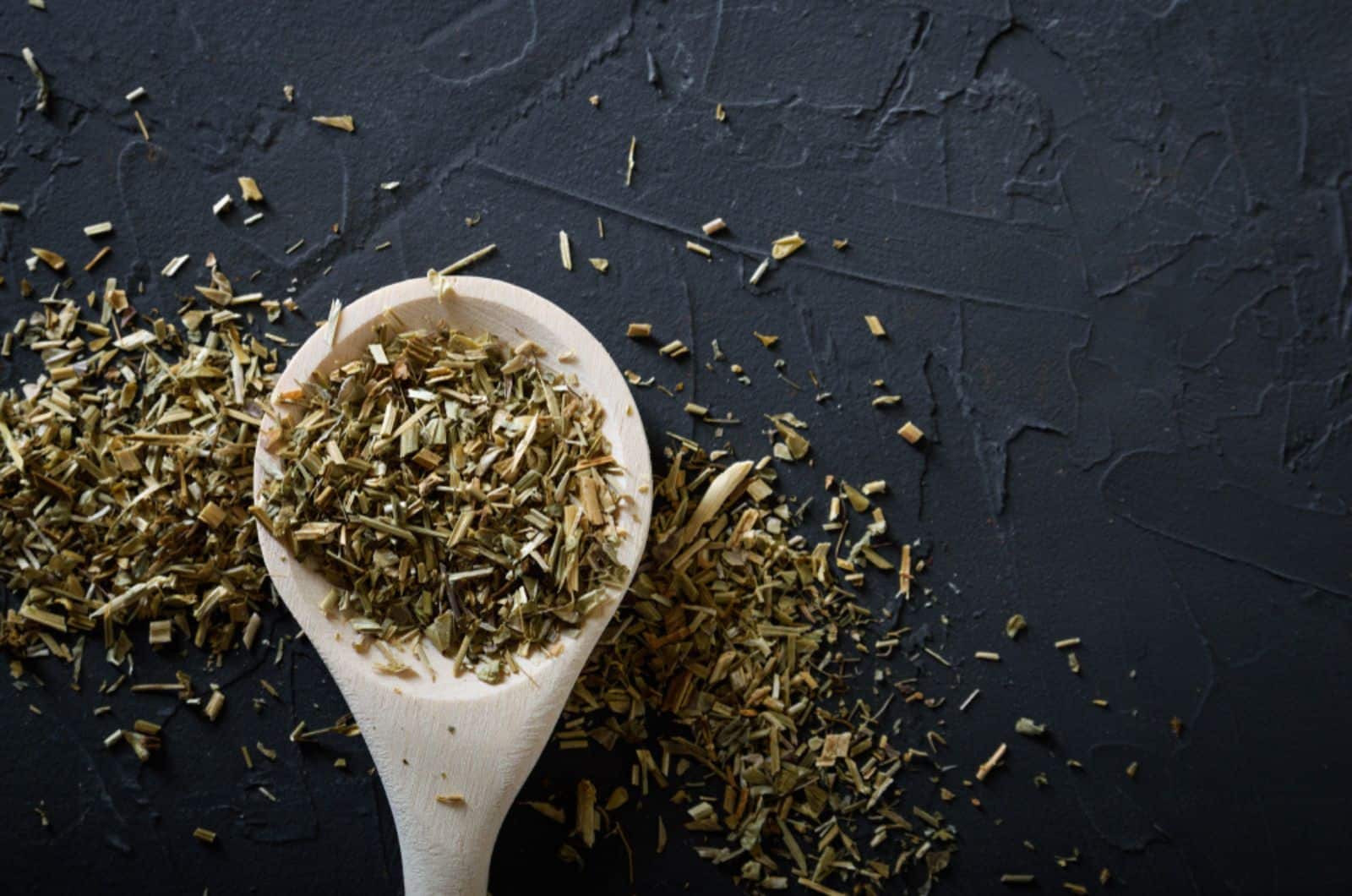 Wooden spoon with Italian seasoning-dried oregano with thyme