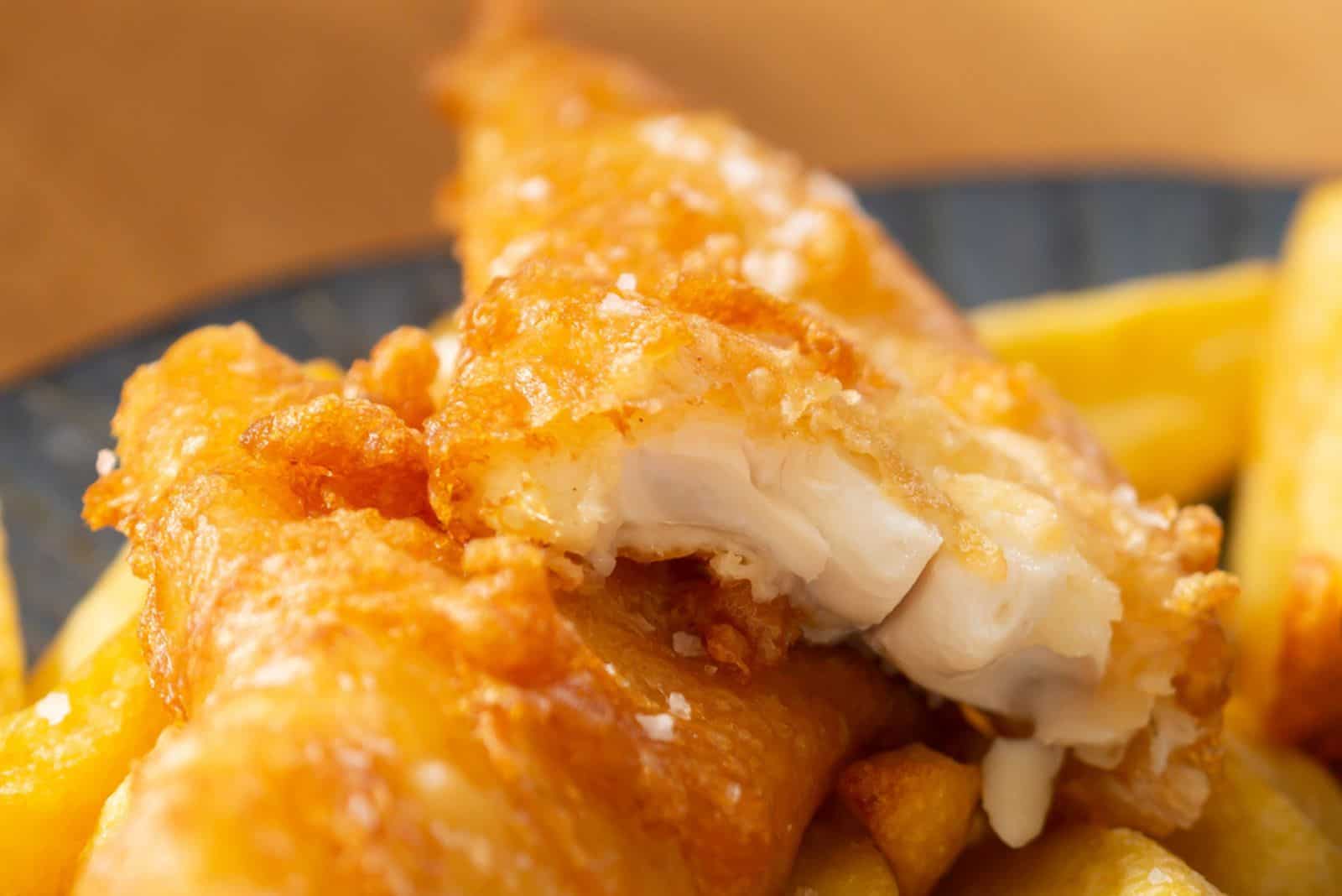 crispy battered fish and chips on plate