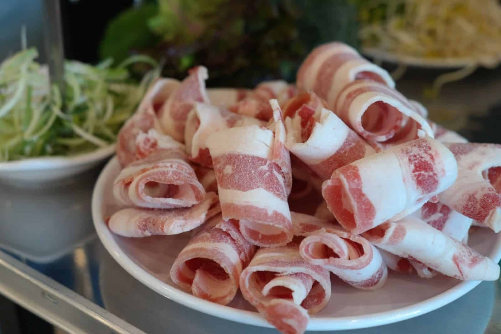 Frozen pork belly prepared by cutting thin and flat