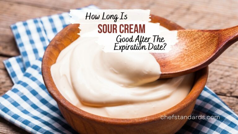 sour cream in a wooden bowl with a spoon
