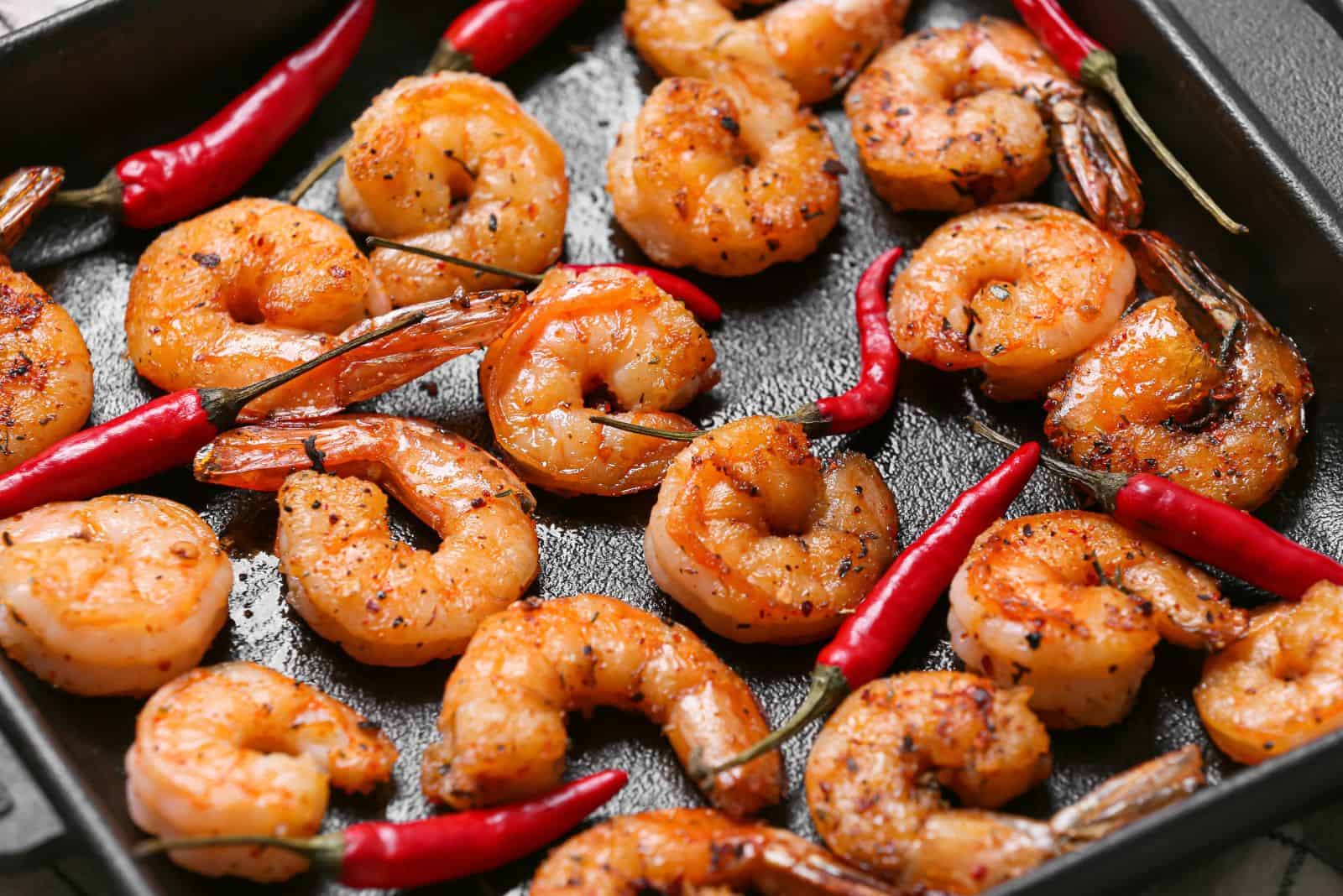 Tasty shrimp tails in baking dish