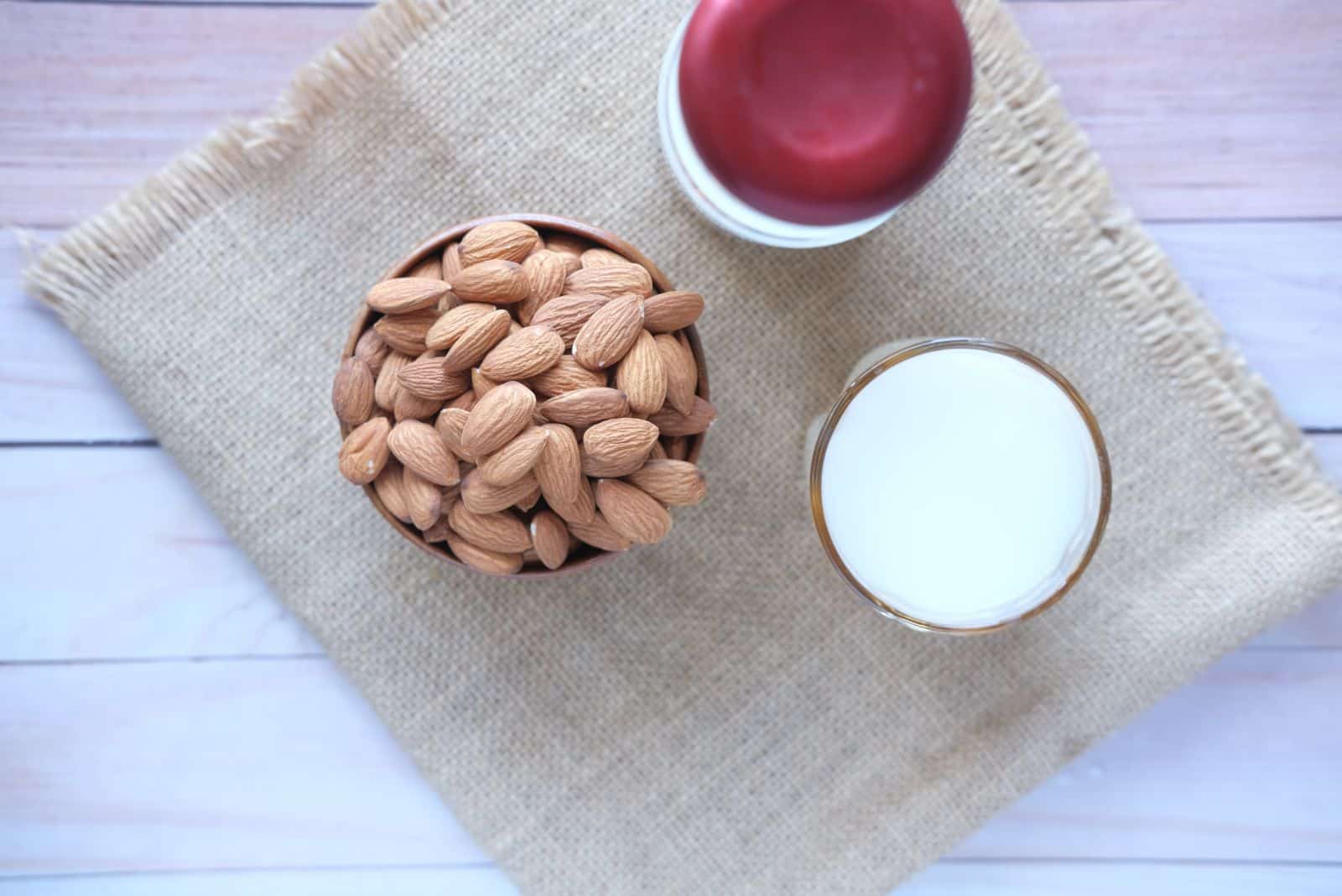 almond nuts and milk on table top