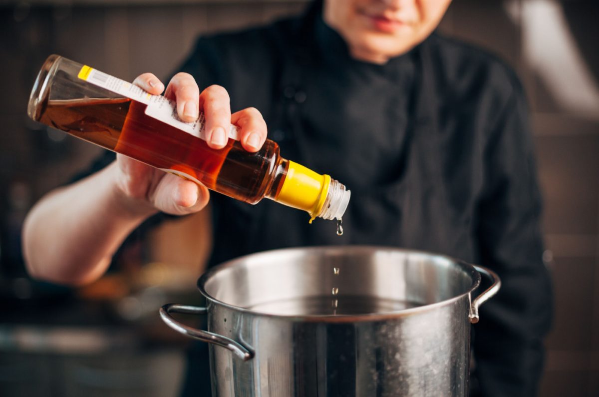 Can You Boil Vinegar Why It Is Not Such A Good Idea   Chef Pouring Vinegar 1200x795 