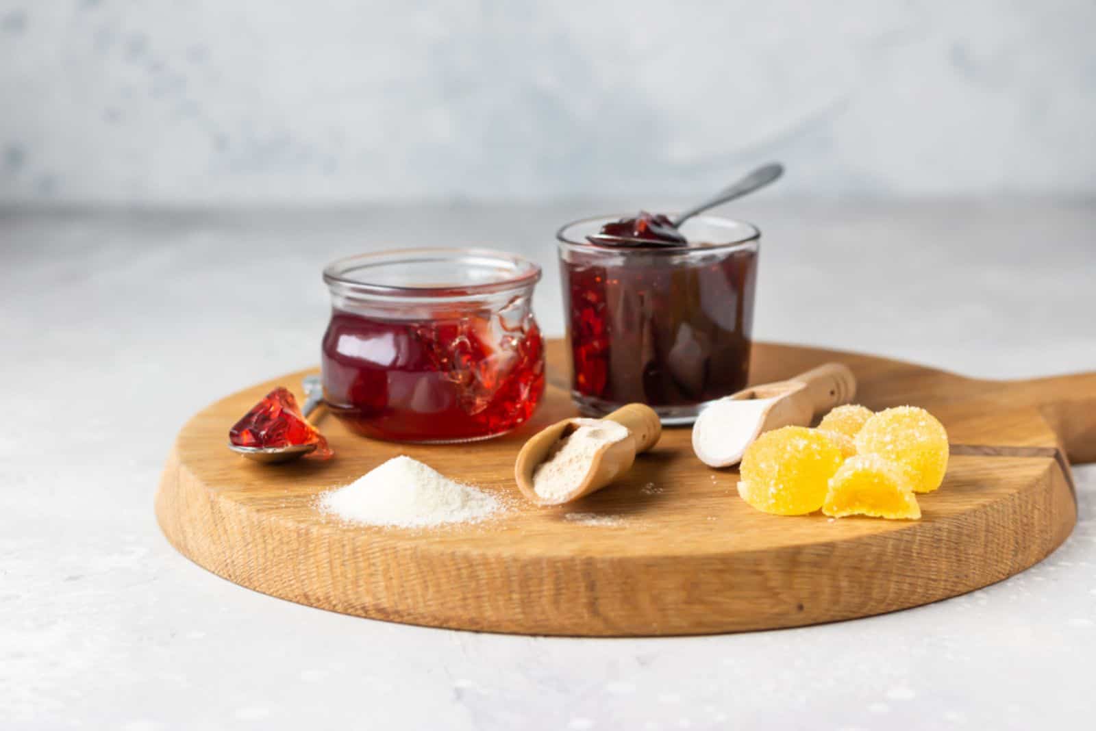 elatin powder, agar-agar and pectin powder on wooden cutting board