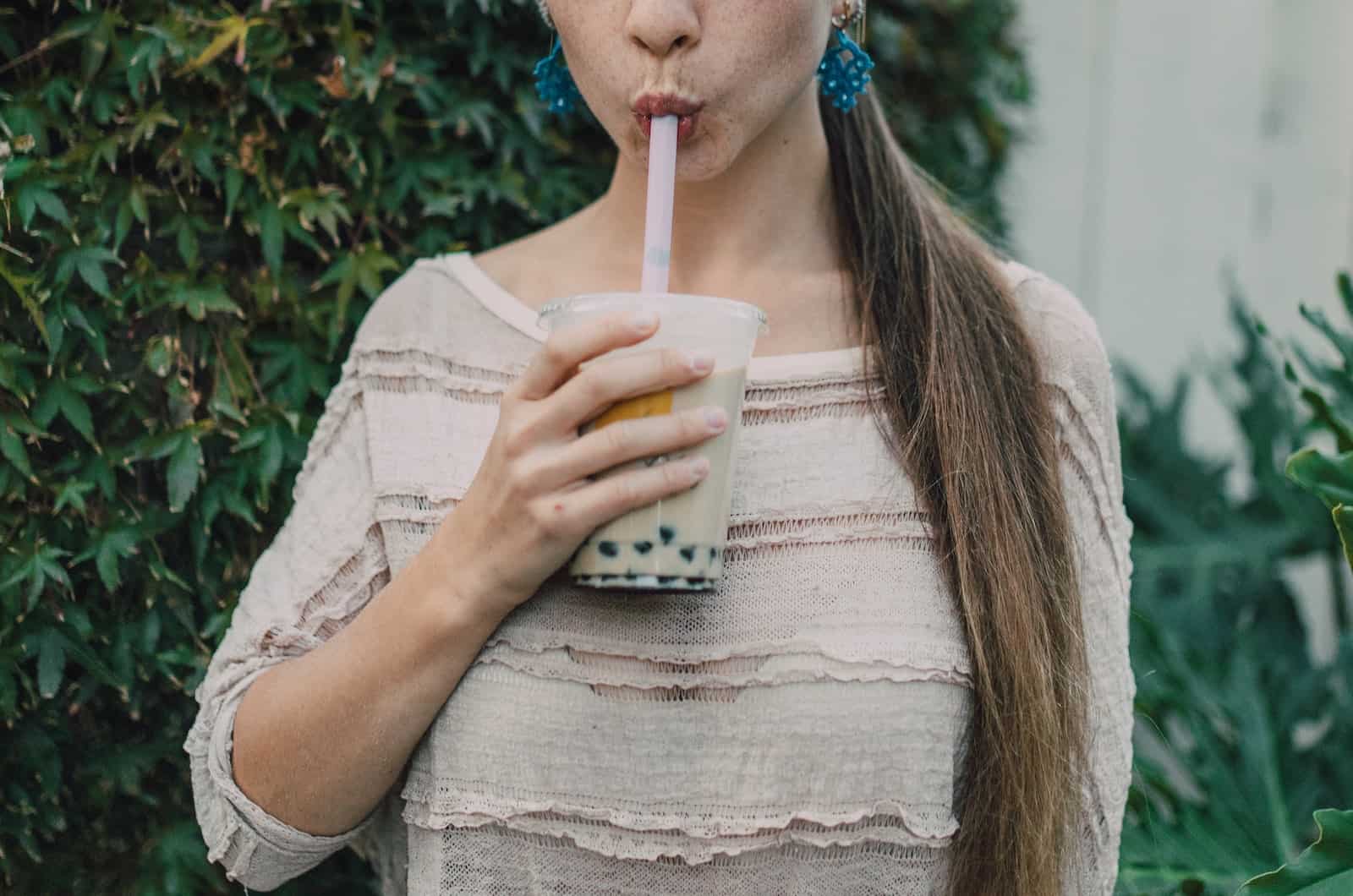 woman drinking boba tea