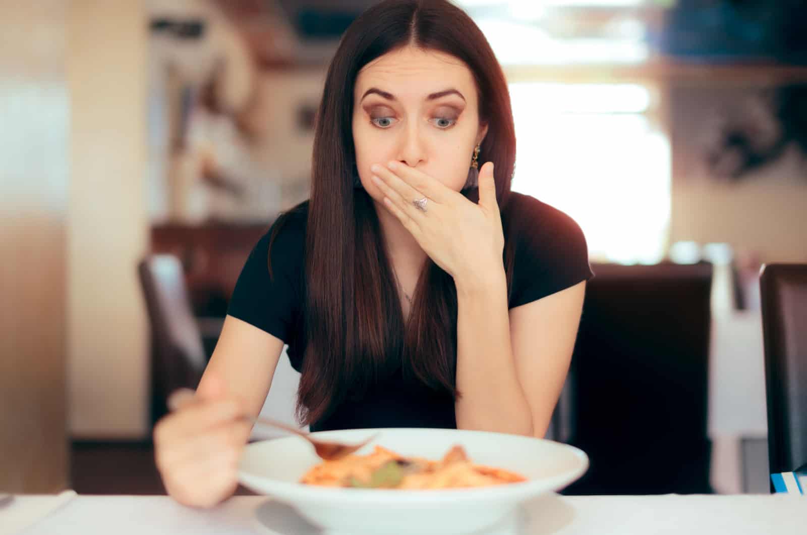 woman feeling sick after eating