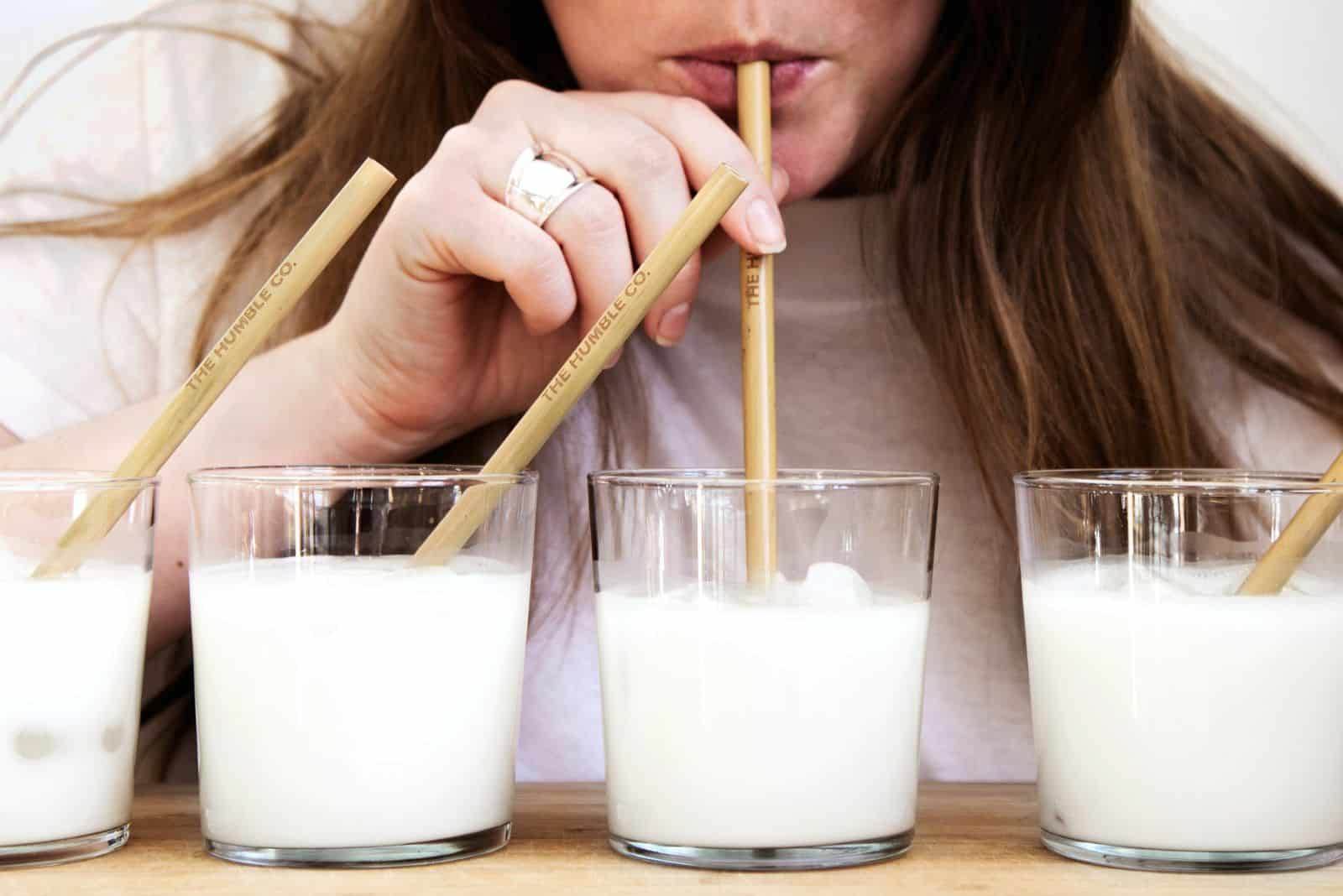 woman tasting almond milk
