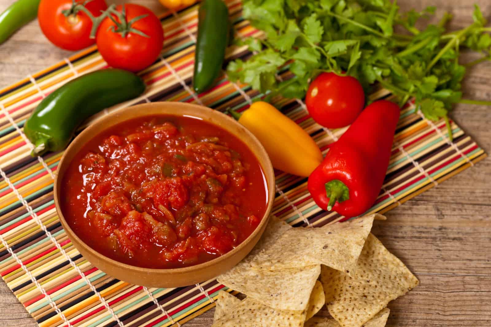 Bowl of red salsa with tortilla chips