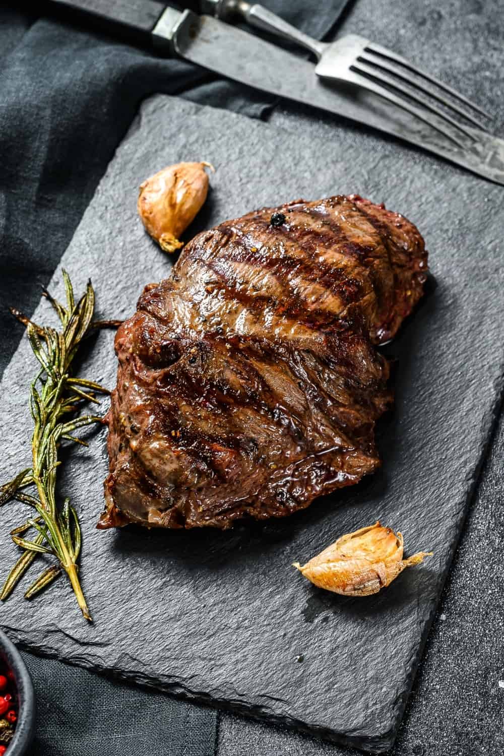 Grilled Flat Iron steak on a stone Board