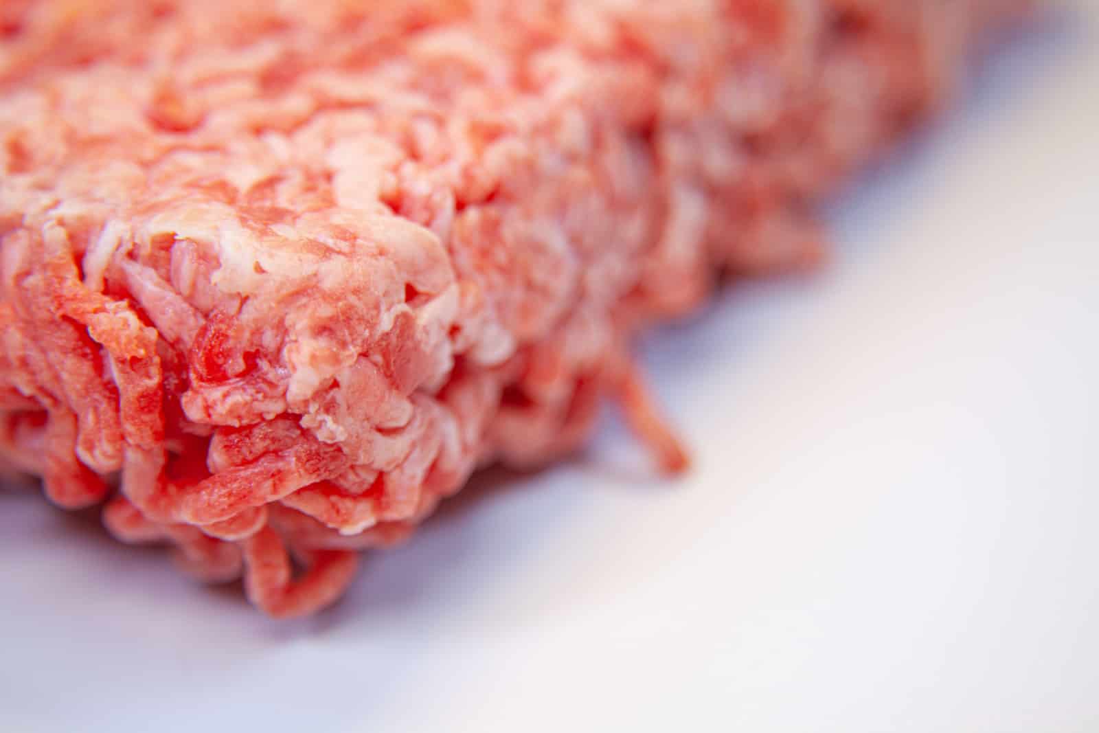 Minced pork and beef frozen, red.
