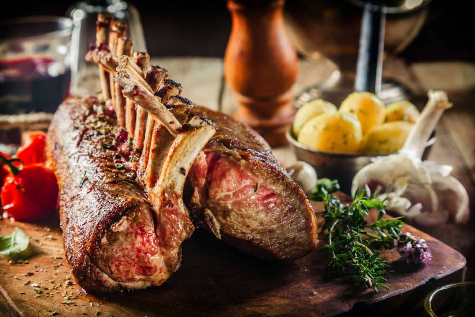 Roasted Rectangle Rack of Lamb Chops on Wooden Cutting Board