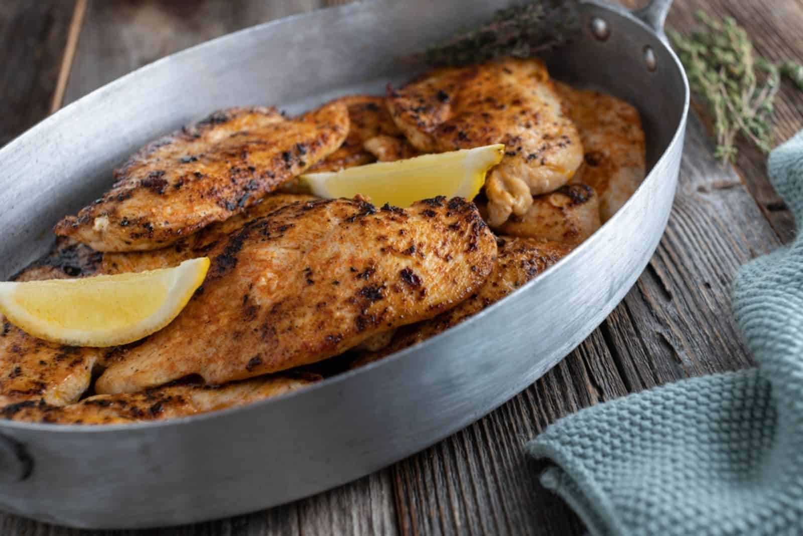 baked thin chicken in a pan