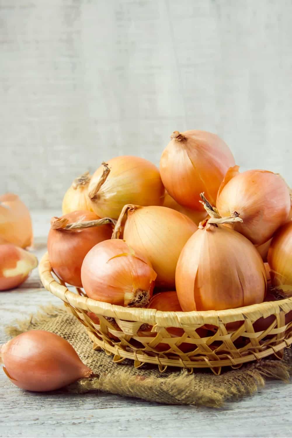 onions in a basket on a table