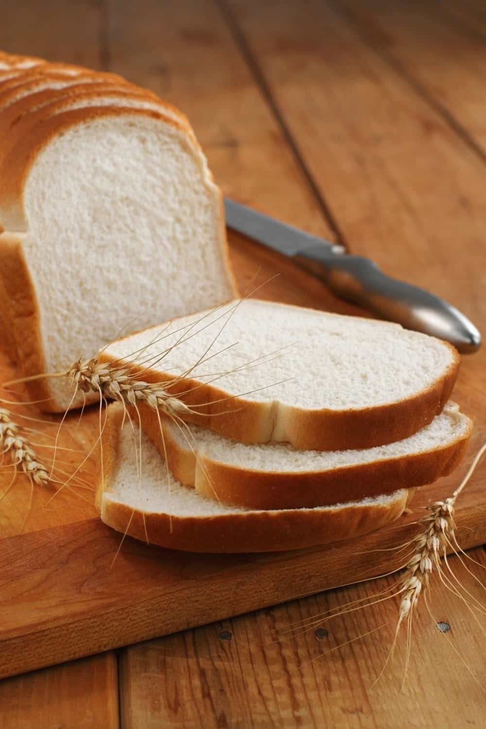 slices of white bread on wooden board