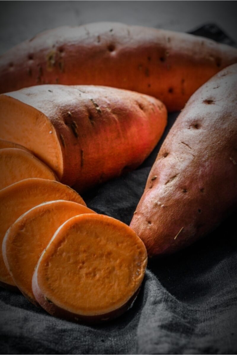 How To Tell If A Sweet Potato Is Bad 10 Storage Tips   Sweet Potatoes On A Black Cloth 800x1200 