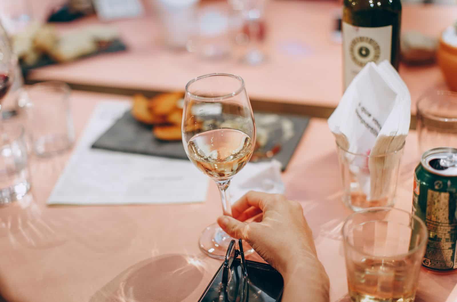 woman drinking white wine