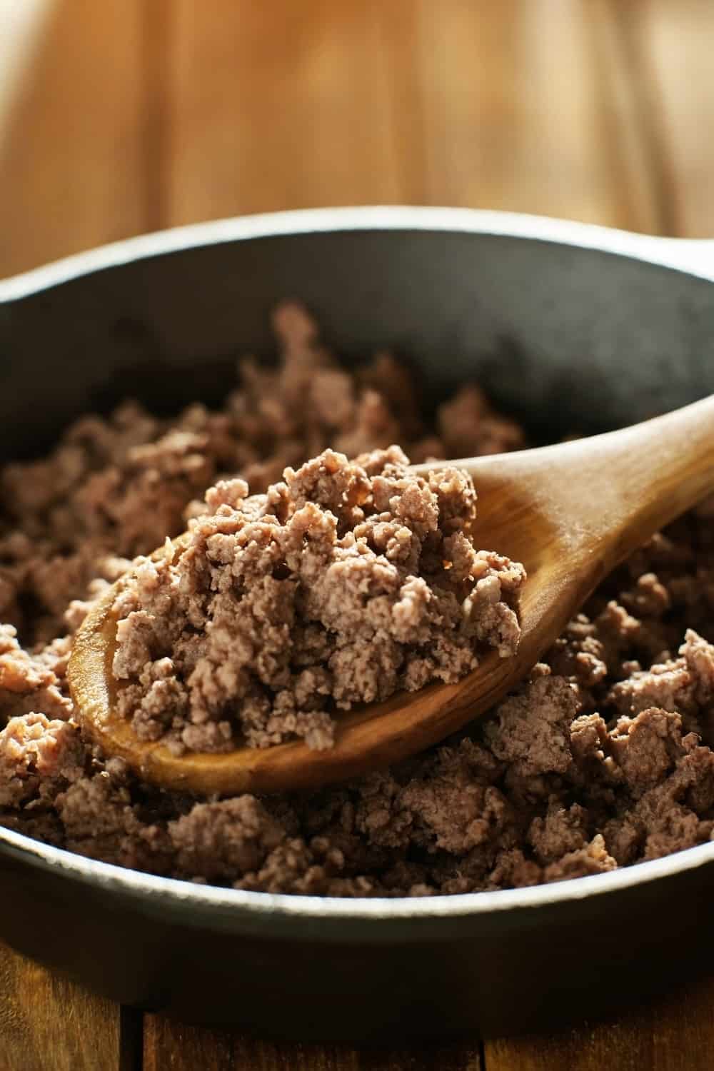 Ground Beef in wooden spoon