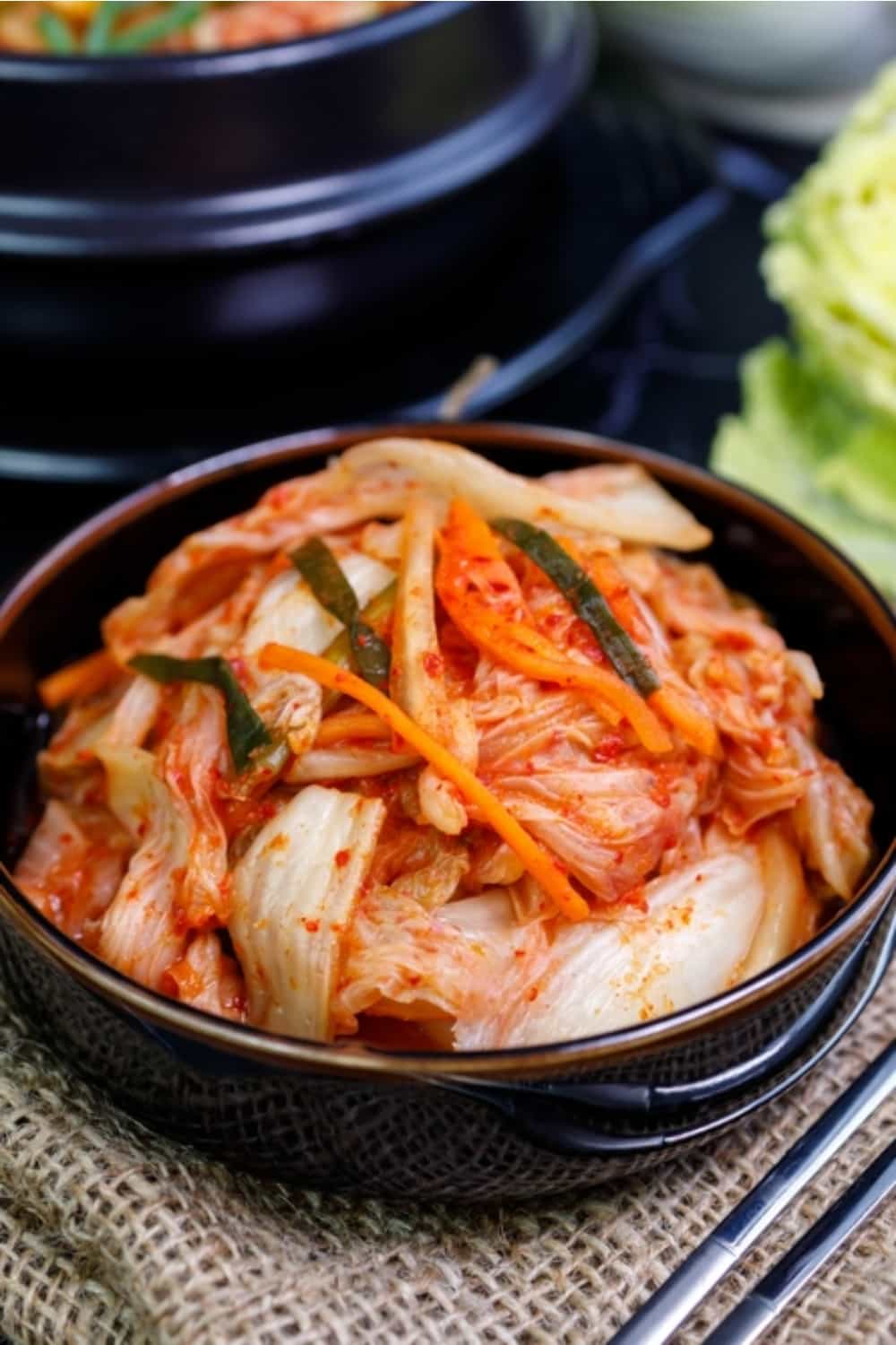 kimchi in a shiny black bowl