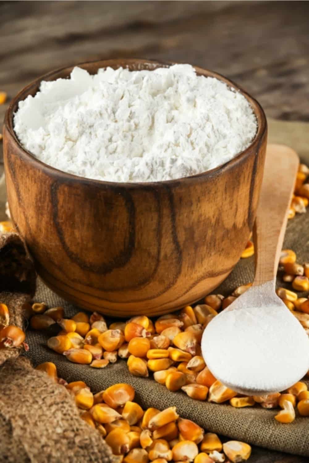 Cornstarch in a wooden bowl with corn