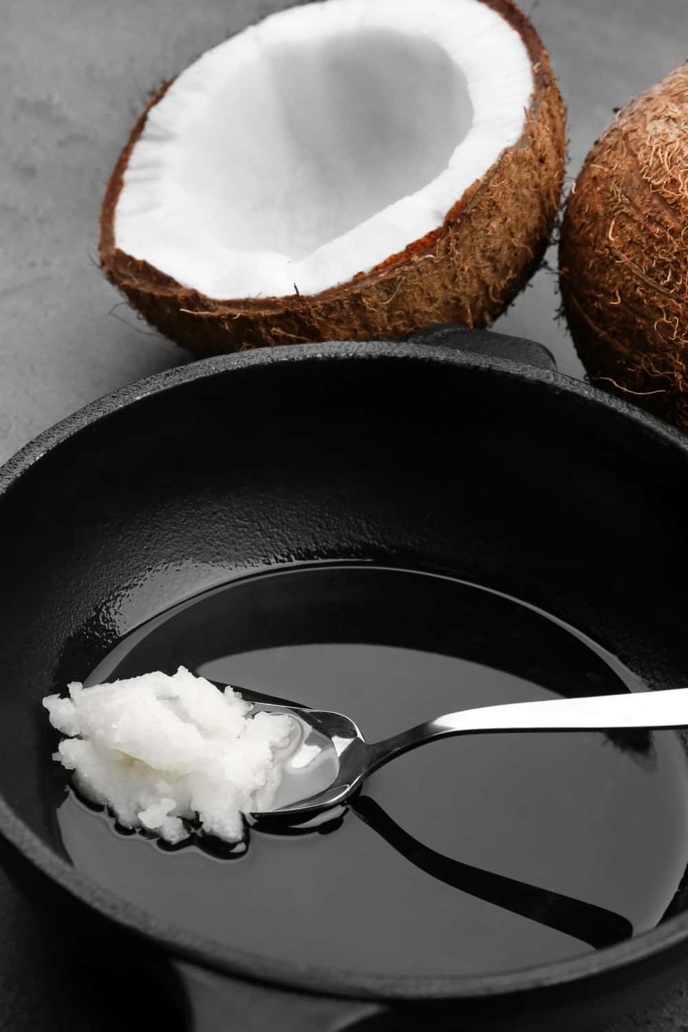a spoon of coconut oil ready to be melted