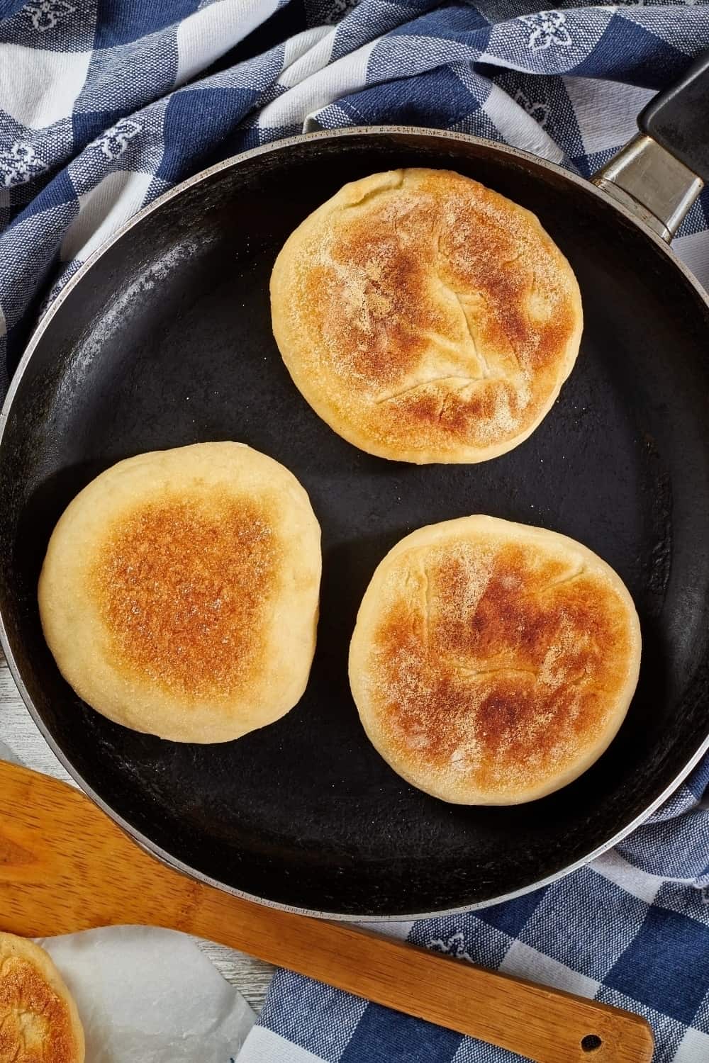 delicious hot english muffins baked on a skillet and on a grid