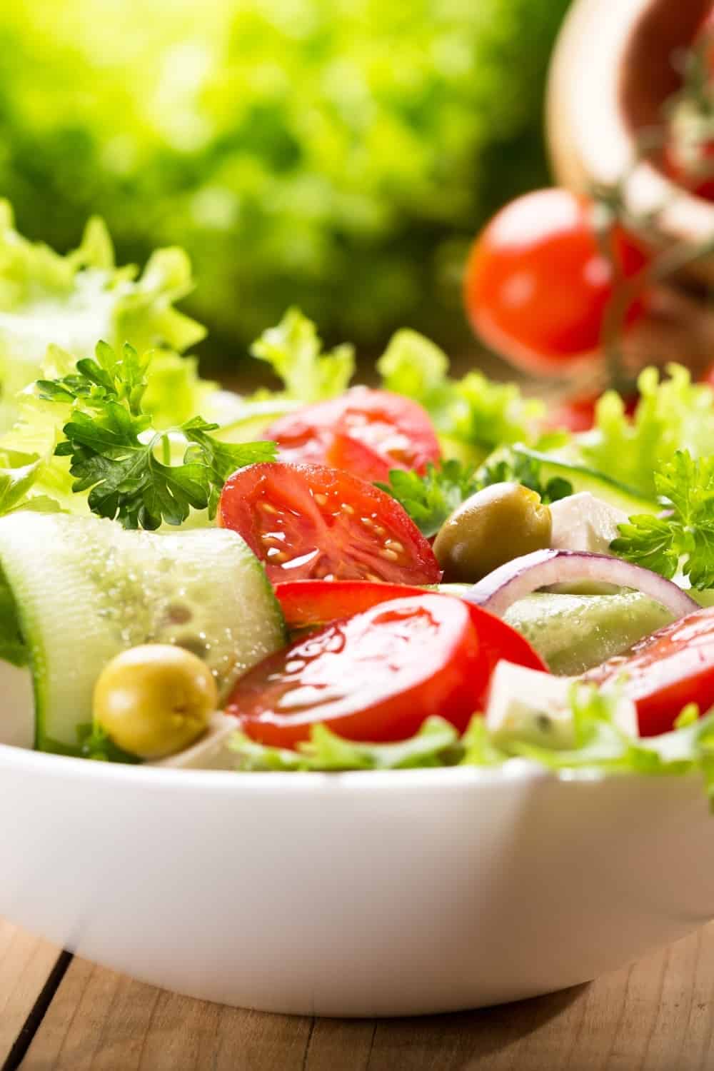 fresh salad in white bowl