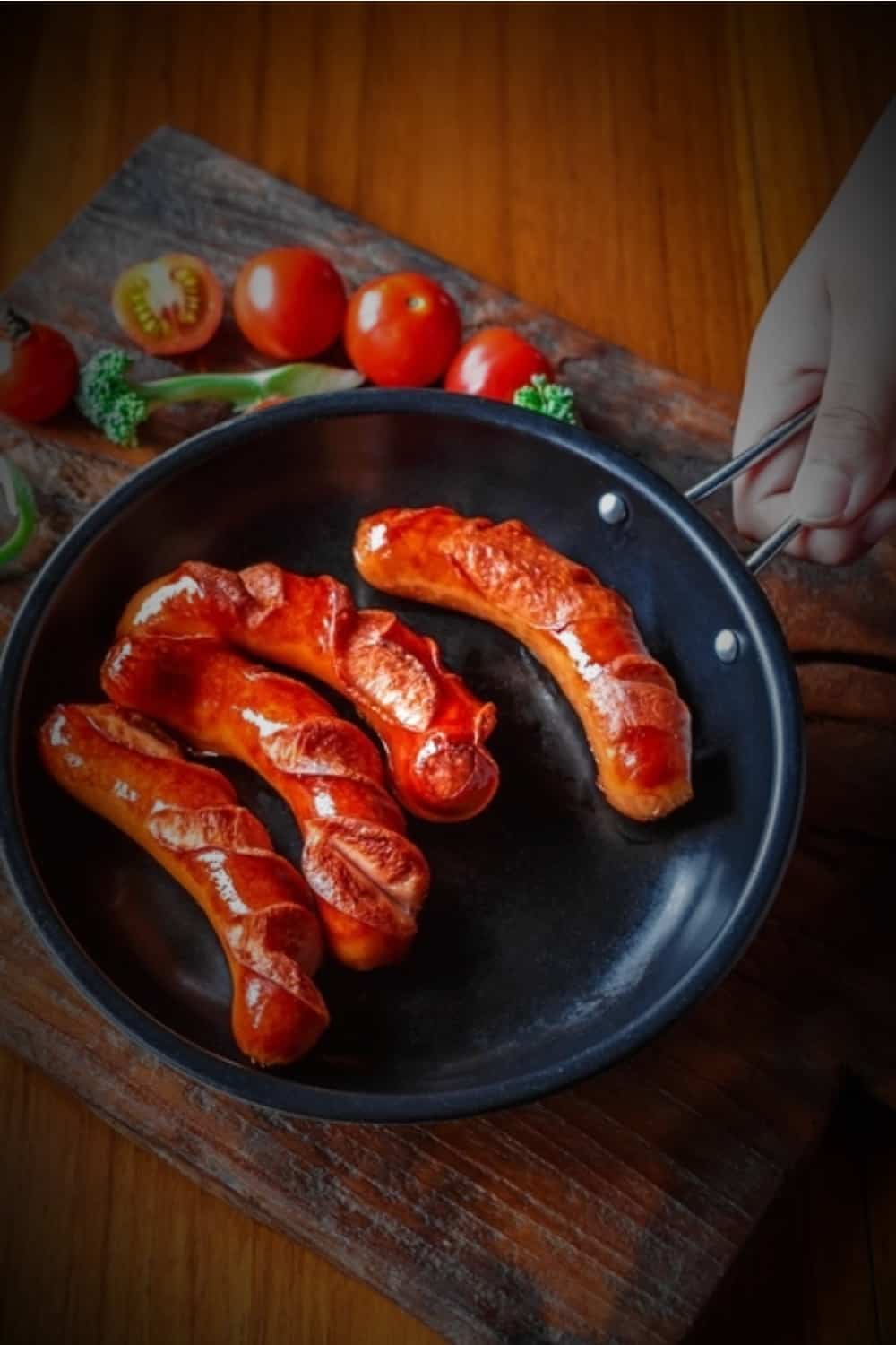 fried sausages in a pan