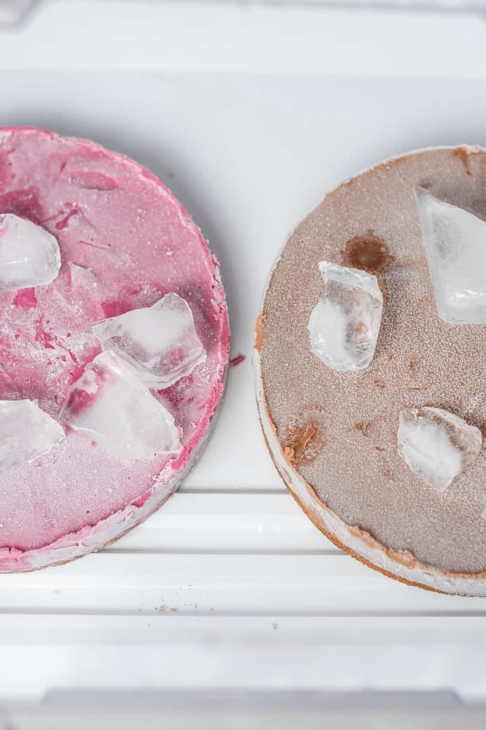 two frozen cakes in the freezer