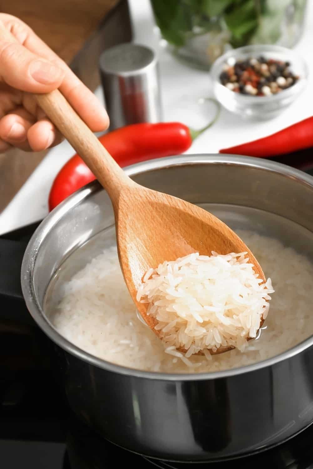woman cooks two cups of rice on stove top