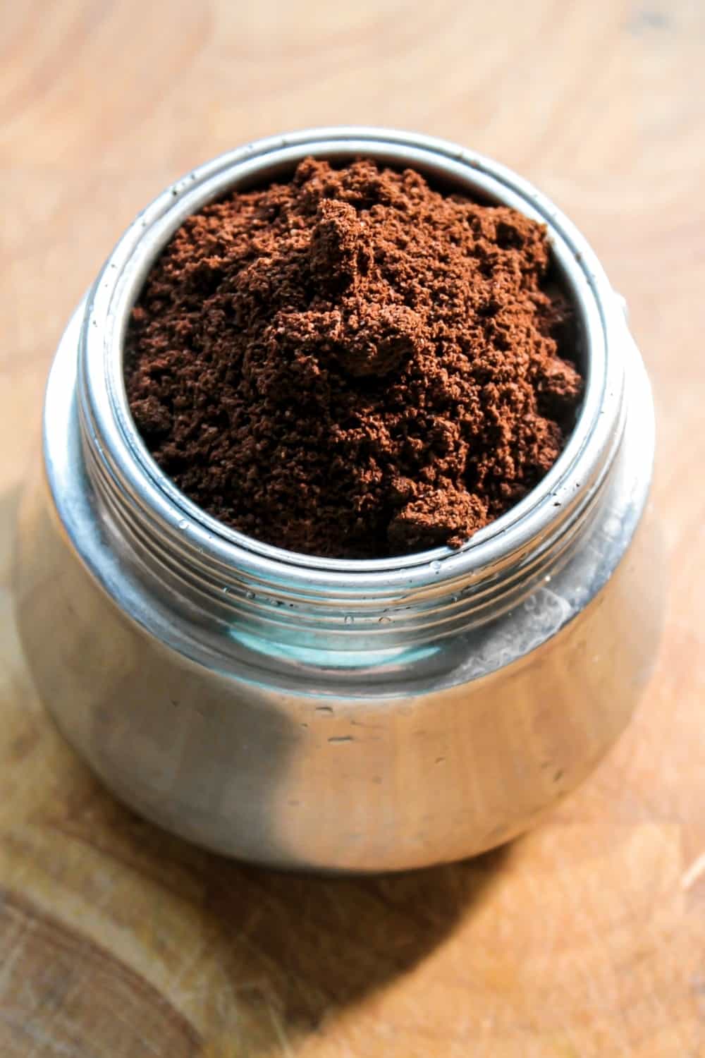Freshly ground espresso powder in an old espresso machine.