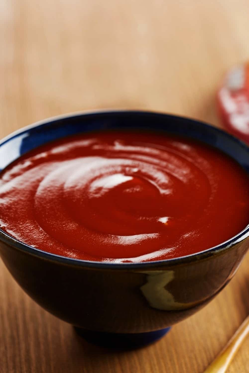 Sriracha in a black bowl