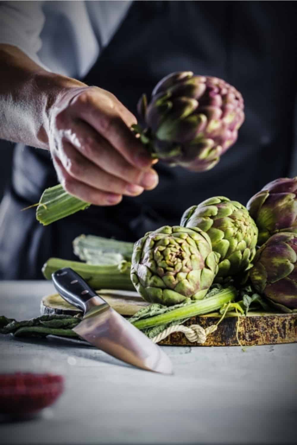 man holding artichoke