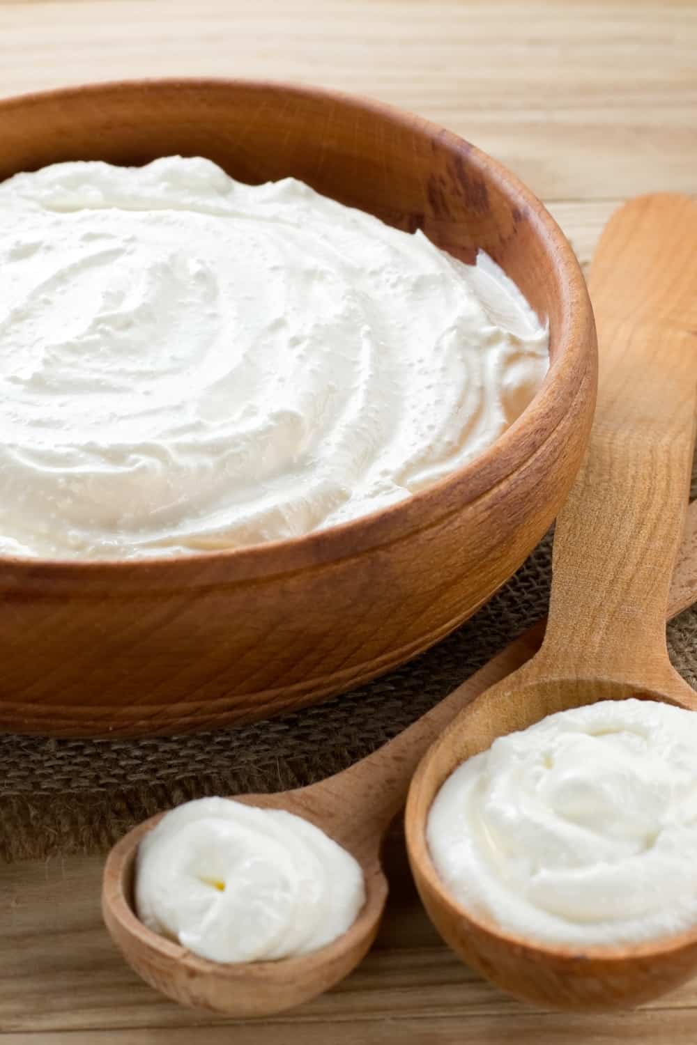 sour cream in a wooden bowl