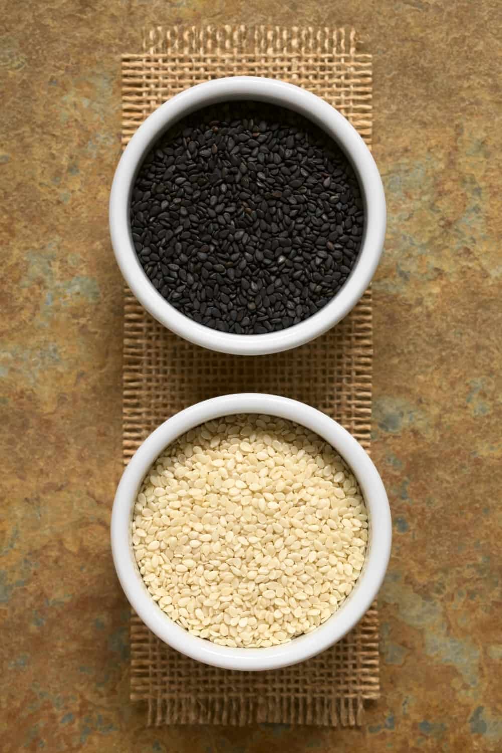 Black and white sesame seeds in small bowls
