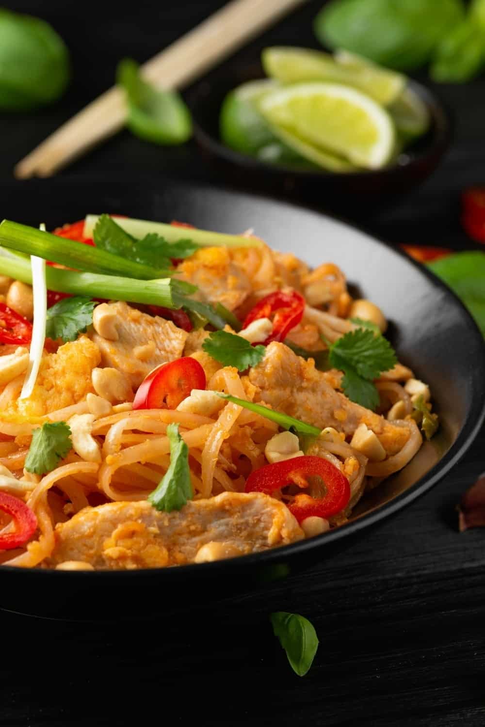 Chicken Pad Thai with eggs, bean sprouts, peanuts and spring onion