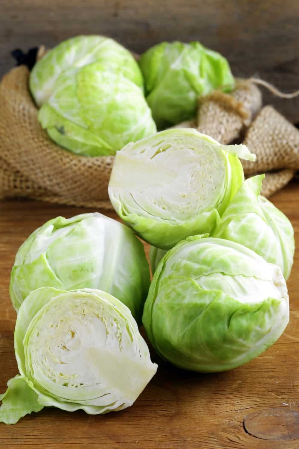 ripe white cabbage on a wooden table