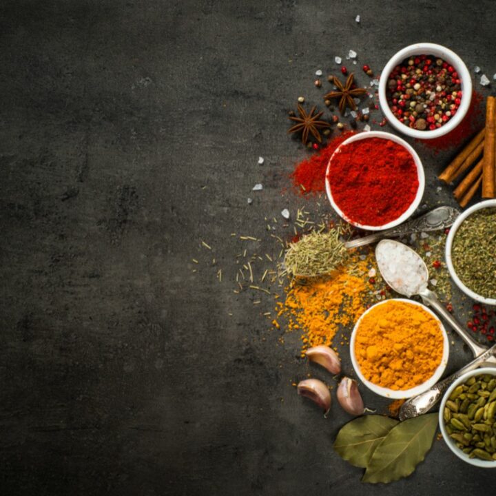 Set of various spices on black background