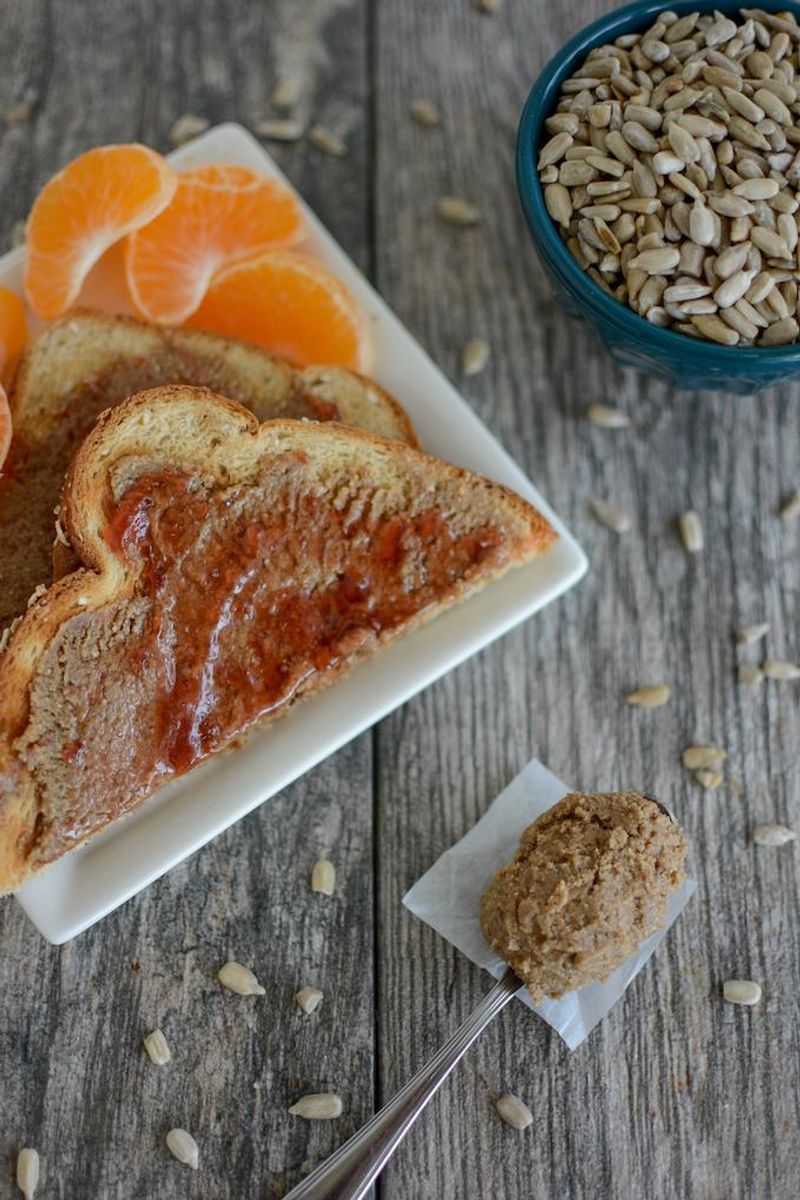 Sunflower Seed Butter Sandwich With Orange Wedges